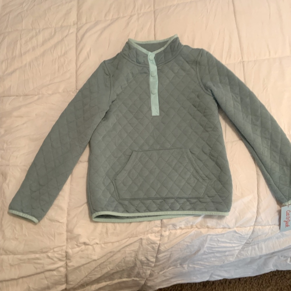 Girls green pull over with tags